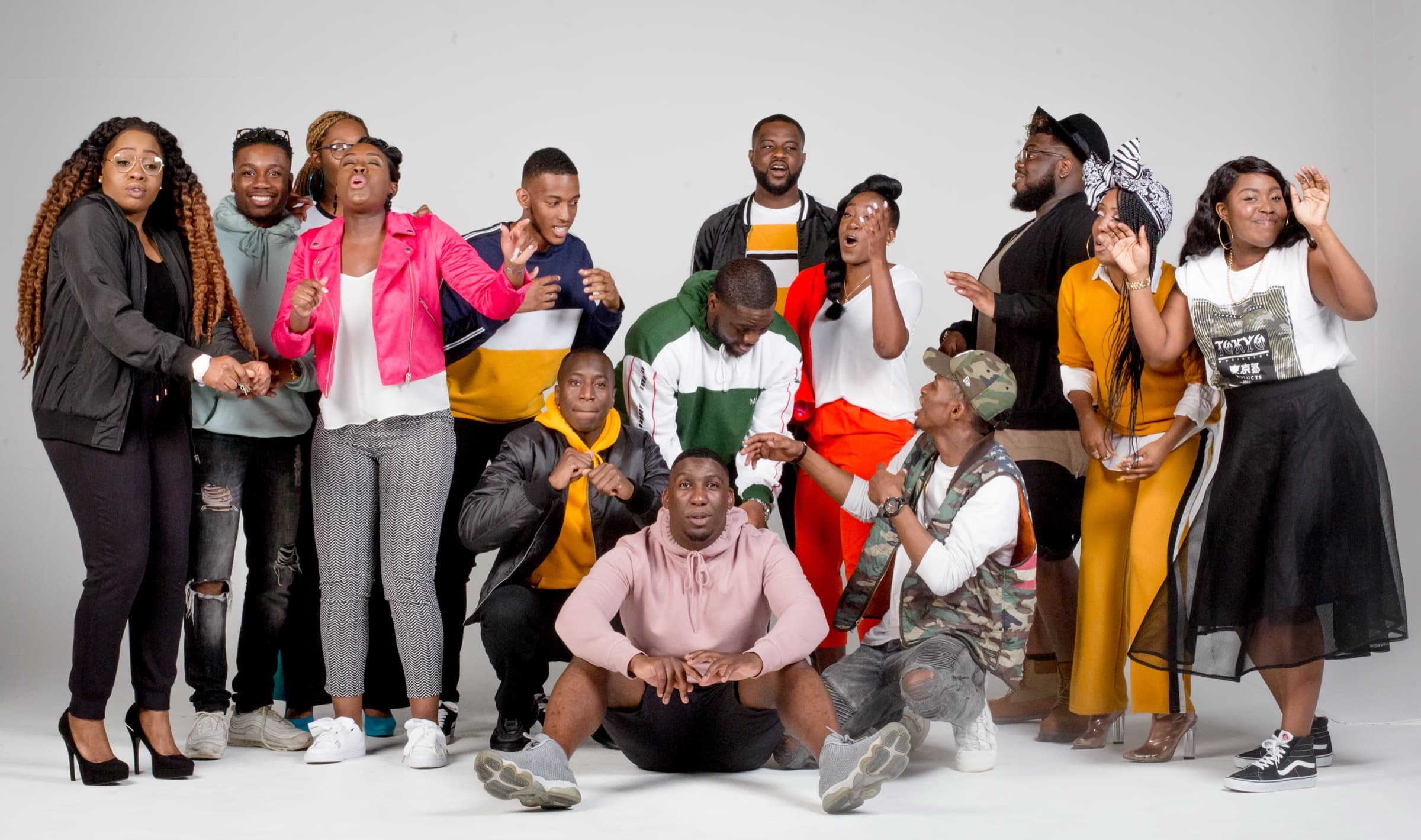 Members of A New Thing posing together in a studio