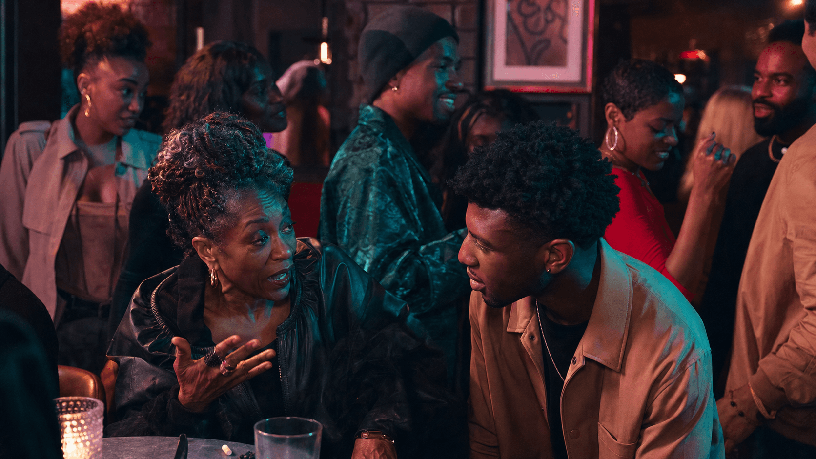 An intergenerational Black British gathering in an arts venue