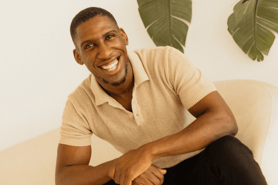 Seth Pinnock seated and smiling