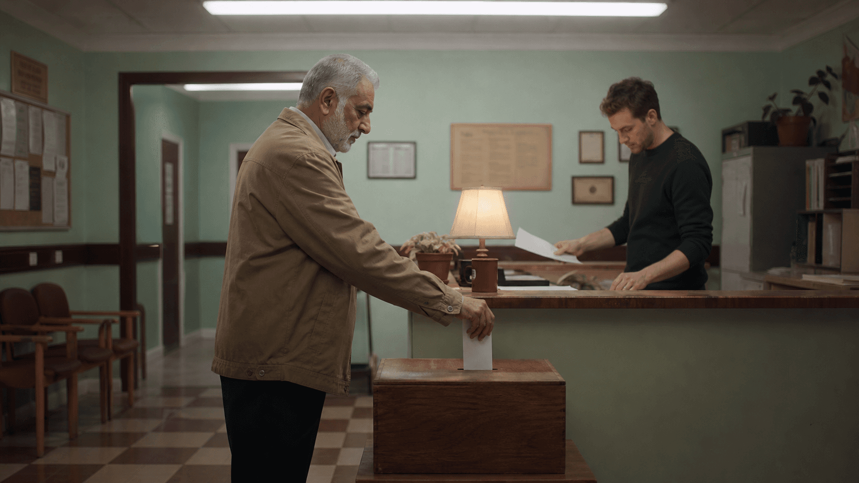 A supporter placing a sealed contribution envelope into a wooden box
