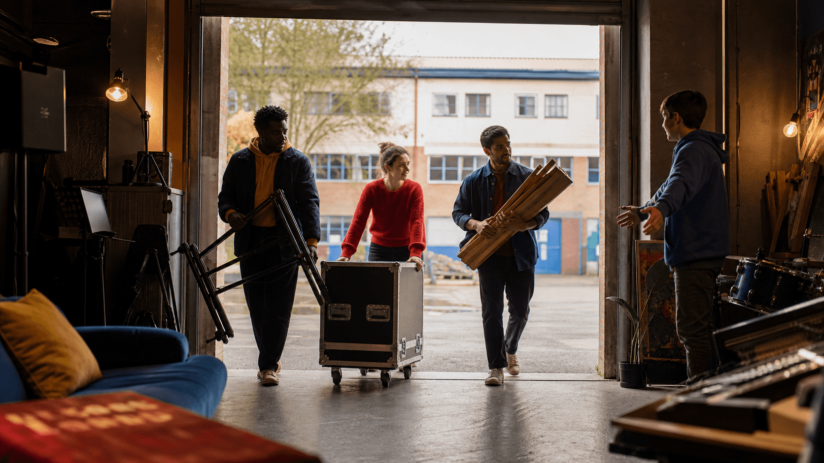 People bringing useful creative equipment into a community studio
